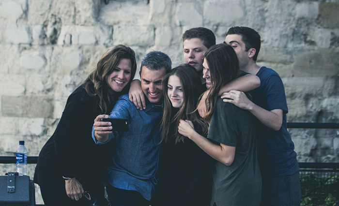 Family taking a selfie picture after the manner of the popular trend. 